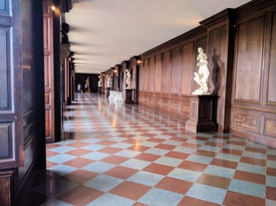 This photo is of a beautifully crafted hallway in Hampton Court Palace. It was used to house orange trees during the winter.